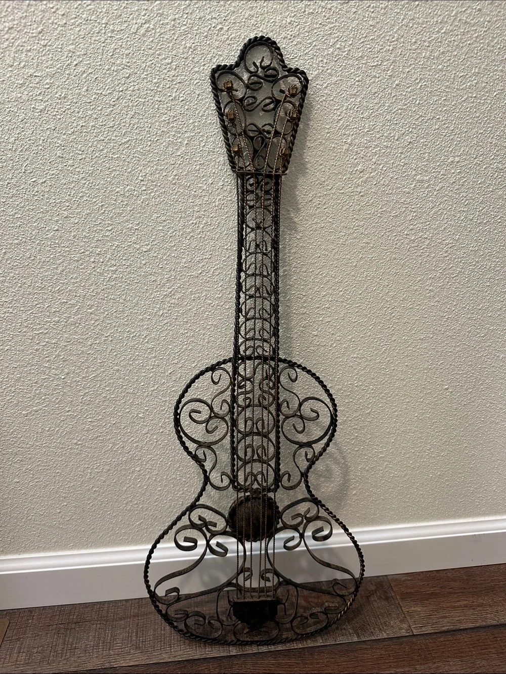 Ornate Metal Guitar Wall Sculpture in Black with distressed Bronze accents